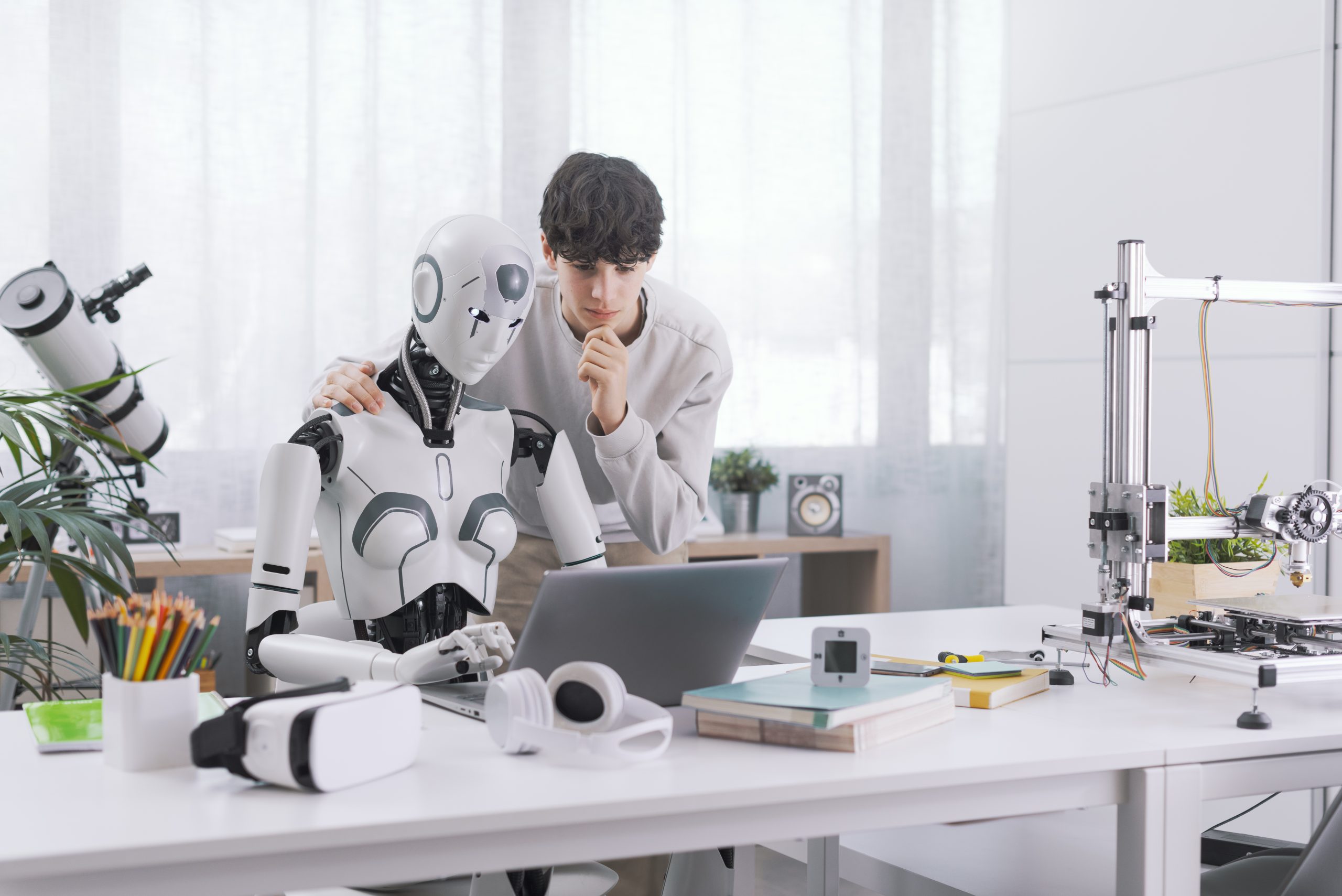 A Boy studies with the help of a Robot. The result is fruitful. Robot and Human Collaboration Concept.